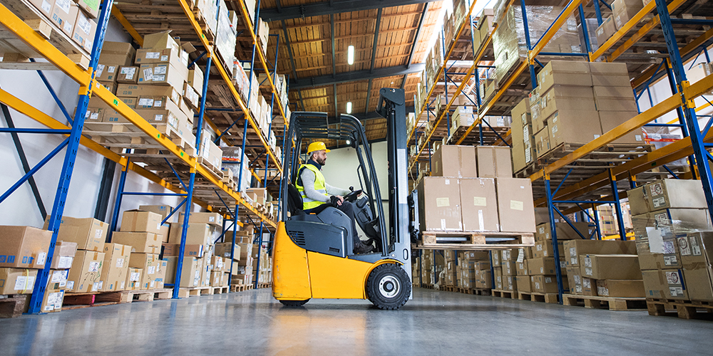 Forklift moving pallets in a warehouse